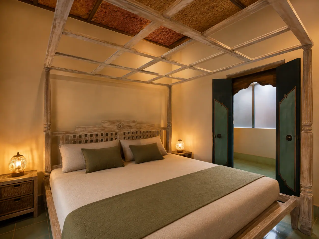 Four-poster bed in the private room with its own bathroom