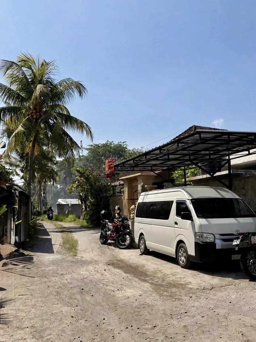 The hostel shuttle van parked outside The Lazy Rabbit
